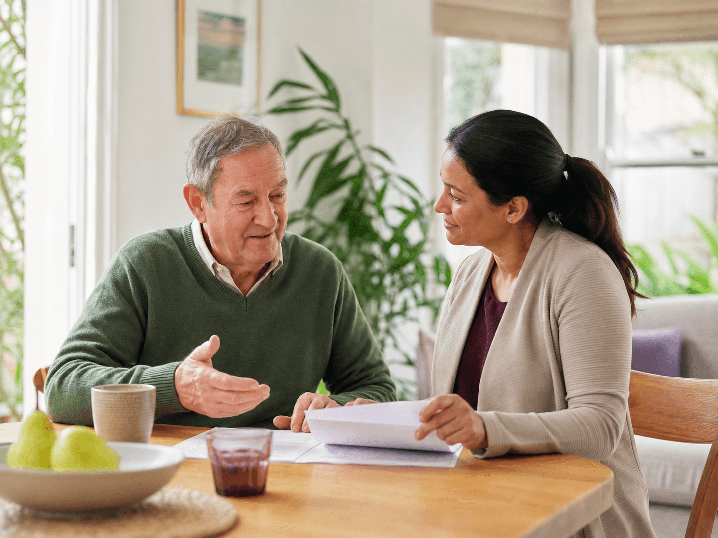 A care coordinator listening to an older client